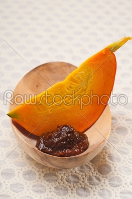 fresh pumpkin slice on wood bowl