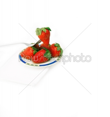 fresh strawberries dish over white