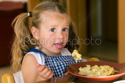 Girl eating Pasta