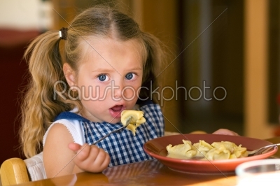 Girl eating Pasta