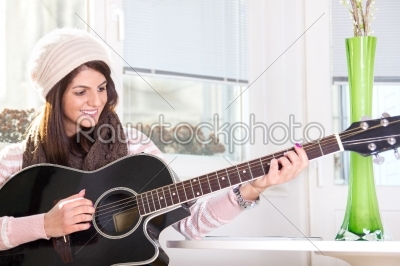 girl playing the guitar