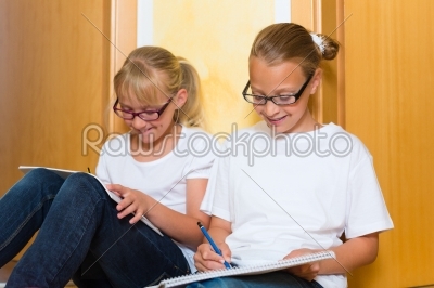 Girls doing homework for school