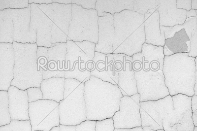Grey concrete wall with cracks