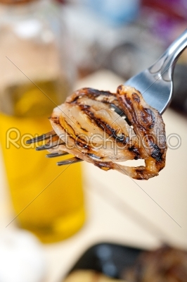 grilled onion on a fork