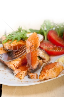 grilled samon filet with vegetables salad