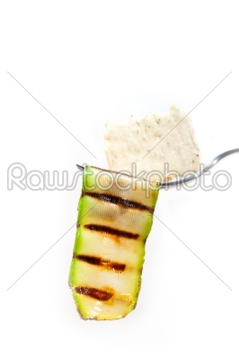 grilled zucchini courgette with cracker on a fork