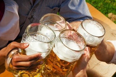 Group of four friends drinking beer