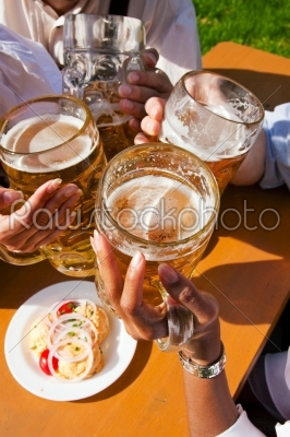 Group of four friends drinking beer