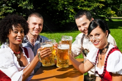 Group of four friends in beer garden