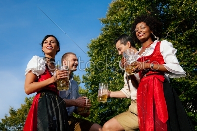Group of four friends in beer garden