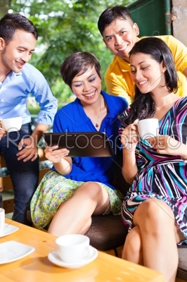 Group of young people in an Asian coffee shop