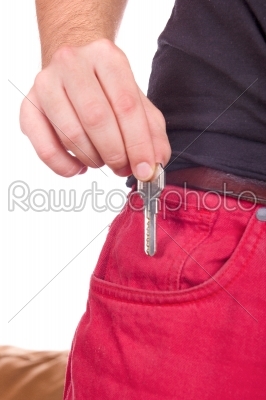 Hand puts the key in pocket