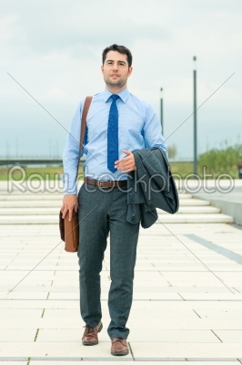 Handsome businessman or manager going home