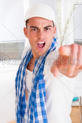 handsome fashion man pointing a finger at the camera