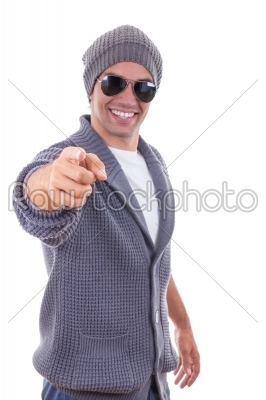 handsome man in sweater pointing with a finger wearing sweater a