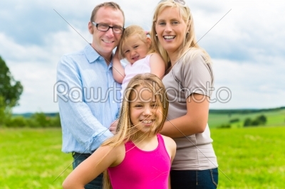 Happy Family in the meadow