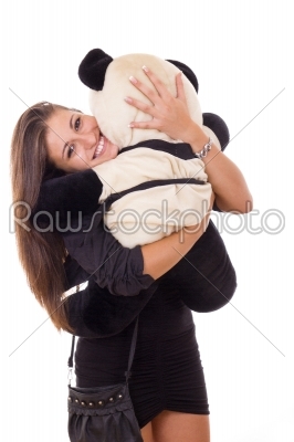 happy thrilled business woman hugging teddy bear