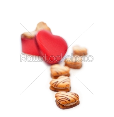 heart shaped cream cookies on red heart metal box