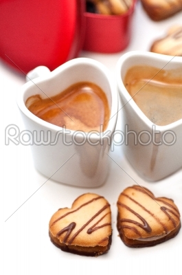 heart shaped cream cookies on red heart metal box and coffee