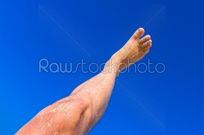 High resolution male leg on blue sky background
