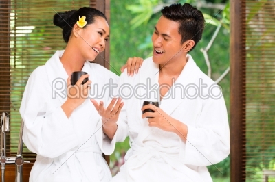 Indonesian Asian couple drinking tea in wellness spa