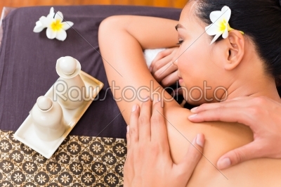Indonesian Asian woman at wellness spa massage