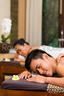 Indonesian couple having wellness massage