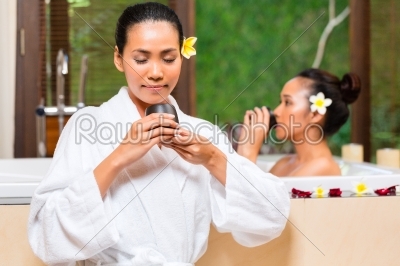 Indonesian women having wellness bath drinking tea