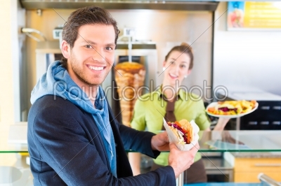 Kebab - customer and hot Doner with fresh ingredients