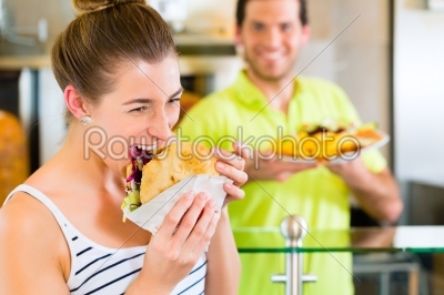 Kebab - customer and hot Doner with fresh ingredients