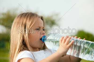 Kid drinking bottled water