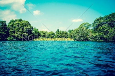 Lake with blue water and green trees