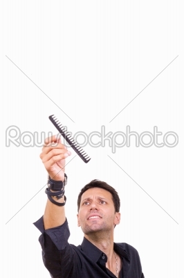 male barber catching comb