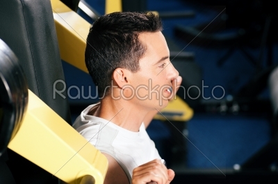 Man exercising and training in gym