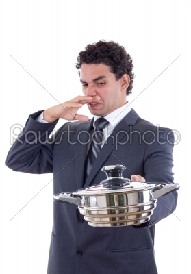 man holding a pot for cooking that really stinks