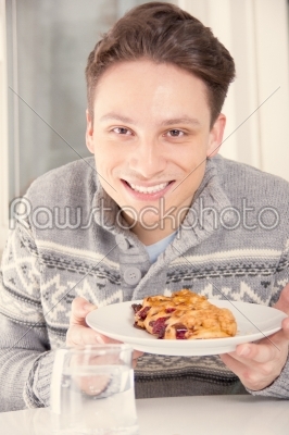 man holding dessert on the plate