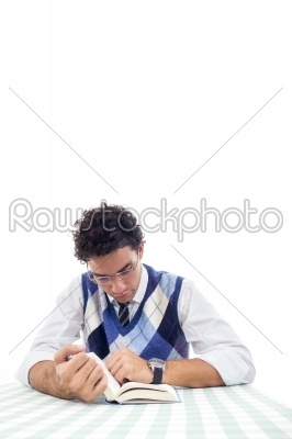 man in shirt and pullover with tie sitting and reads book