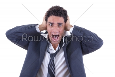 man in suit holding his head and screaming