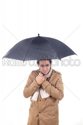 man in the coat with umbrella freezes