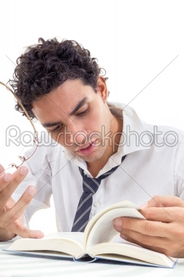 man in the shirt with tie sitting and reads book