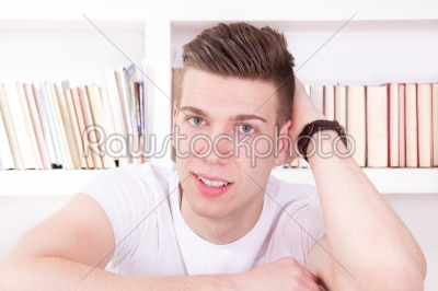 man leaning on the bed posing