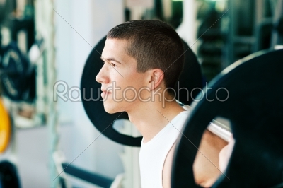 Man lifting weights in gym