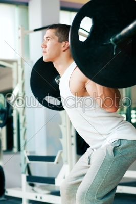 Man lifting weights in gym