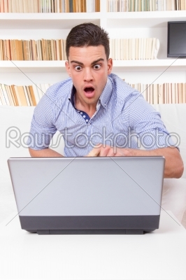 man looks surprised at content on computer monitor failure