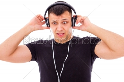 man shocked by what he hears on headphones