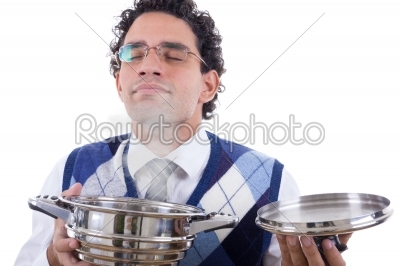 man smelling delicious lunch from pot