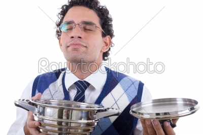 man smelling lunch from pot