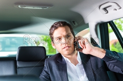 Man traveling in taxi, he has an appointment