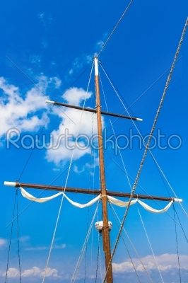 masts of sailing ships lying at the wharf skyline