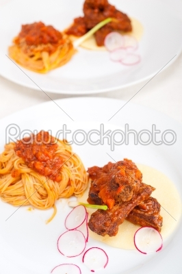 pasta with pork ribbs sauce on polenta bed